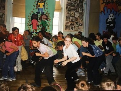 Colby Minifie and other kids are slightly bending forward while dancing.